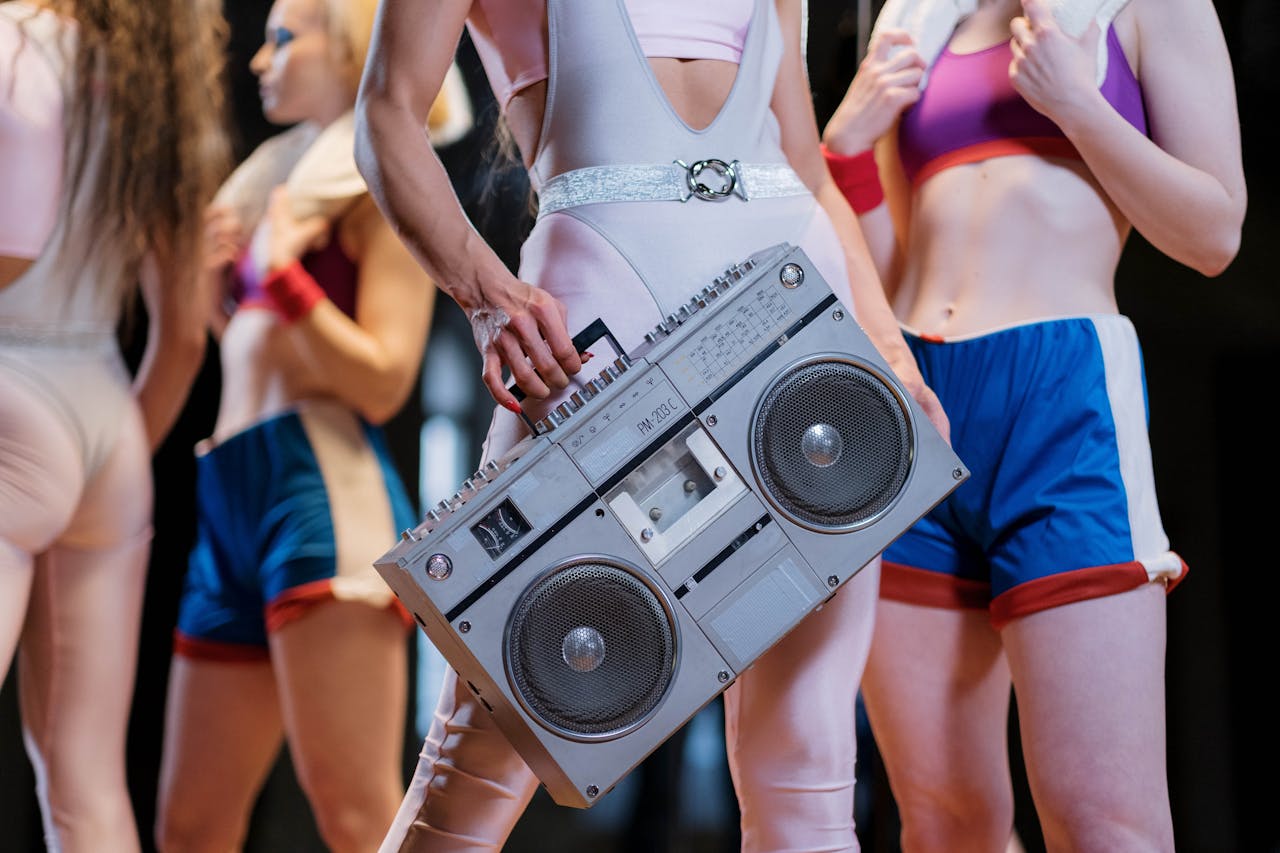 Close-Up Shot of a Person Holding a Boombox